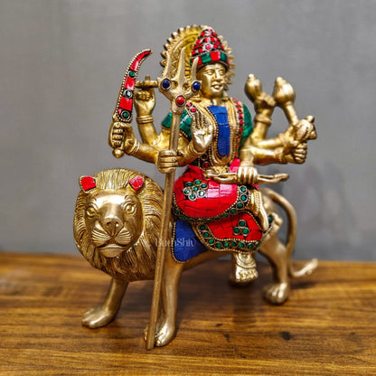 Goddess Durga brass idol with 8 arms sitting on lion with stonework 9 inches