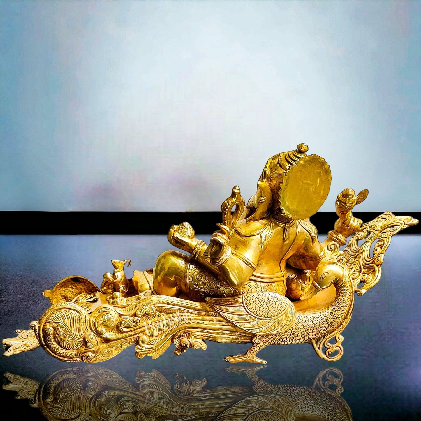 Handcrafted Brass Ganesha Resting on Peacock Bed | Divine Golden Finish 33"