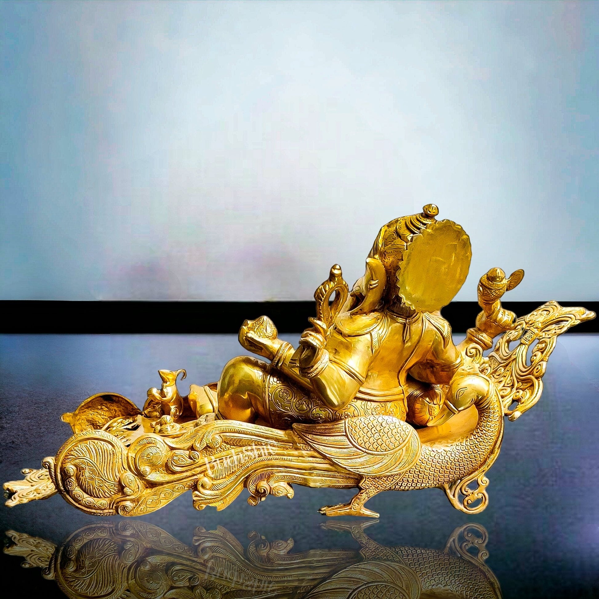 Handcrafted Brass Ganesha Resting on Peacock Bed | Divine Golden Finish 33"