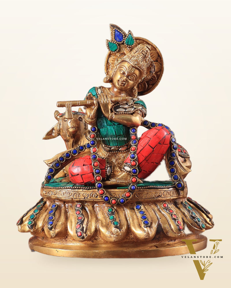 krishna seated with a cow on round base 7.5"