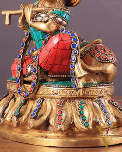 krishna seated with a cow on round base 7.5"