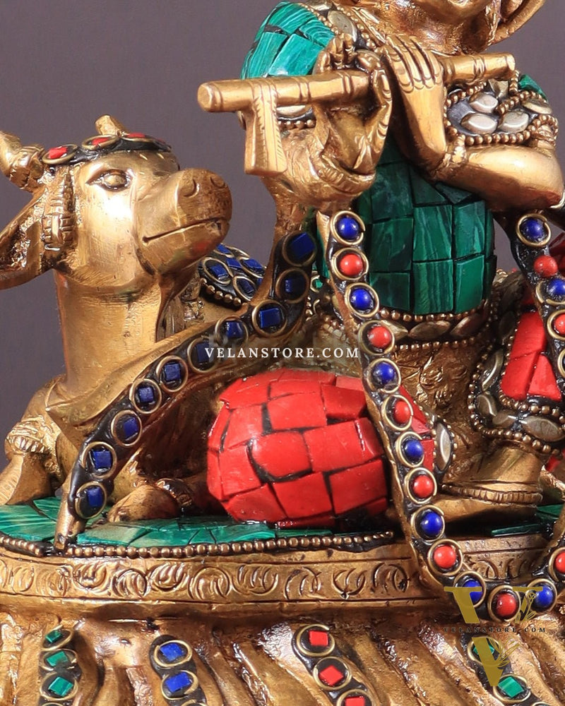 krishna seated with a cow on round base 7.5"