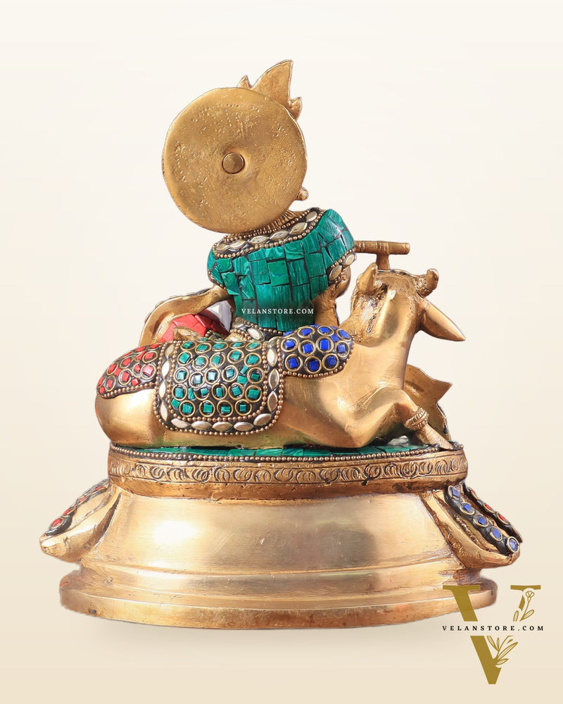 krishna seated with a cow on round base 7.5"