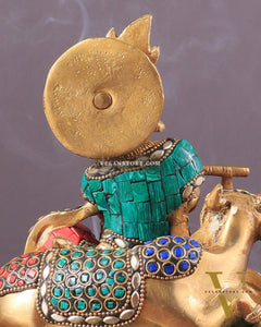 krishna seated with a cow on round base 7.5"