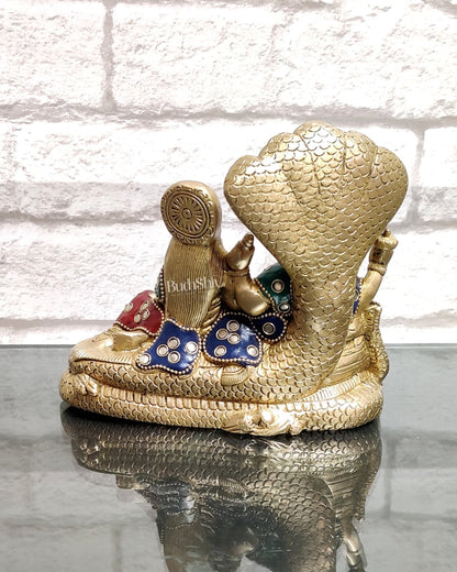 Lakshmi Narayan/ Vishnu Lakshmi brass idol resting on Sheshnaag Golden finish