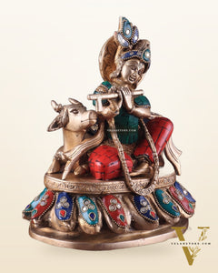 Lord krishna seated with cow brass idol with stonework 7.5 inch stonework
