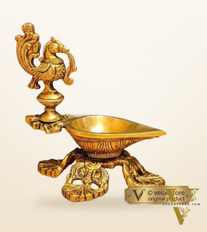 Peacock / annam design brass diya with 4 legged stand