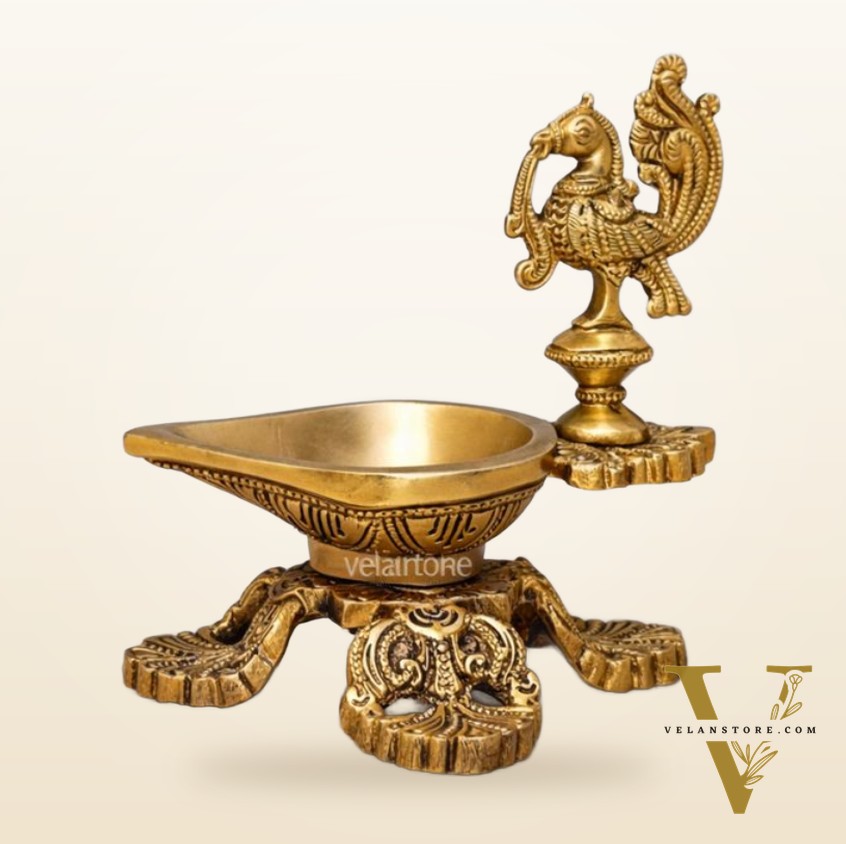 Peacock / annam design brass diya with 4 legged stand