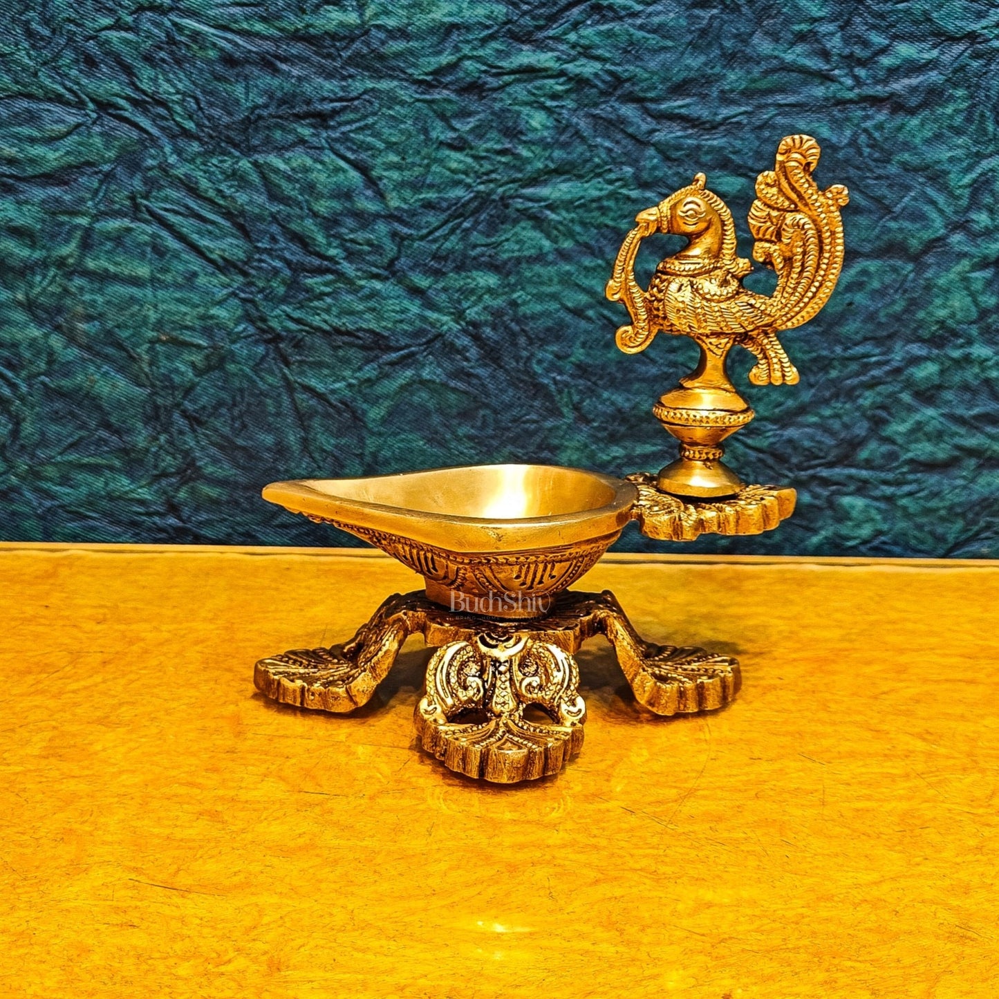 Peacock / annam design brass diya with 4 legged stand