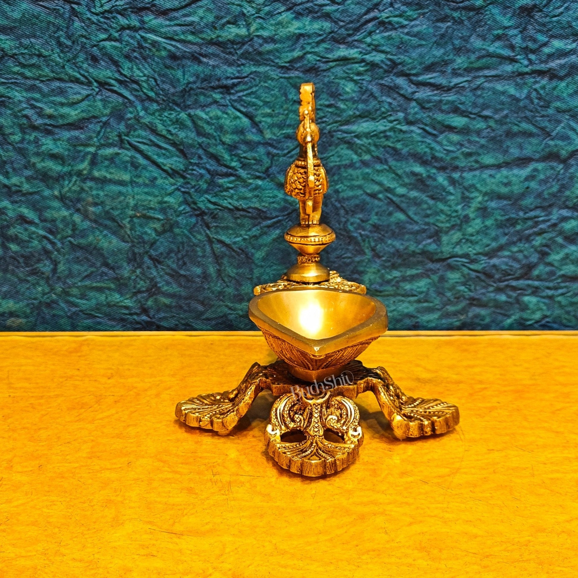 Peacock / annam design brass diya with 4 legged stand