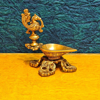 Peacock / annam design brass diya with 4 legged stand