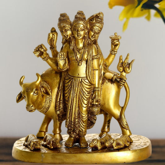 Brass Three faced Dattatreya guru with a cow and four dogs.